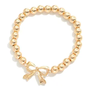 Gold Tone Beaded Stretch Bracelets With Bow Charm