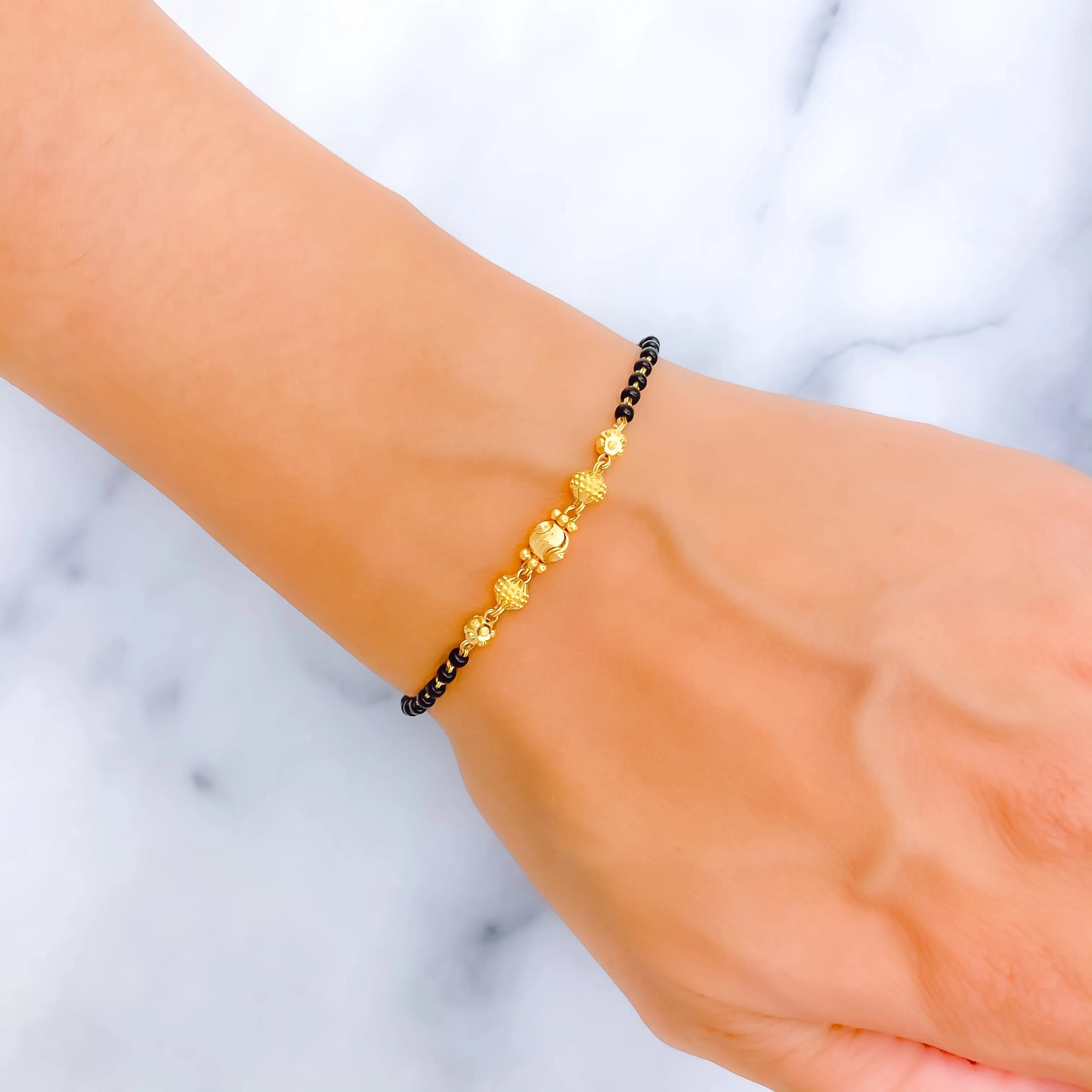 Shimmering Graceful 22k Gold Black Bead Bracelet