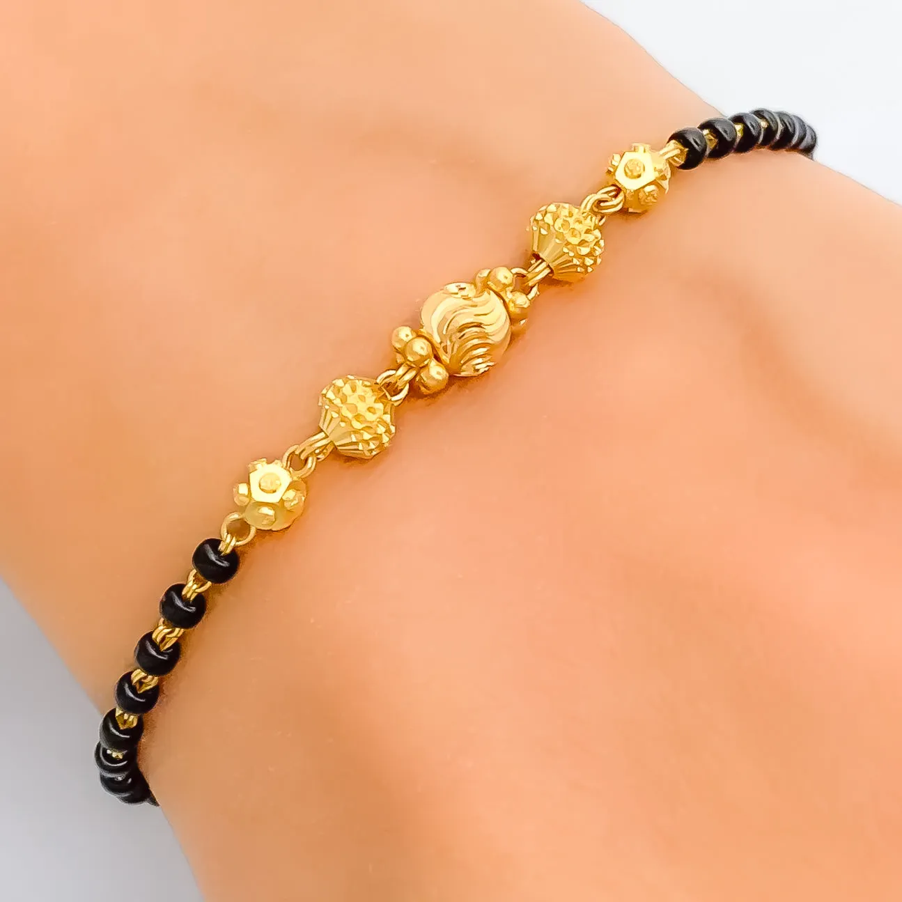 Shimmering Graceful 22k Gold Black Bead Bracelet