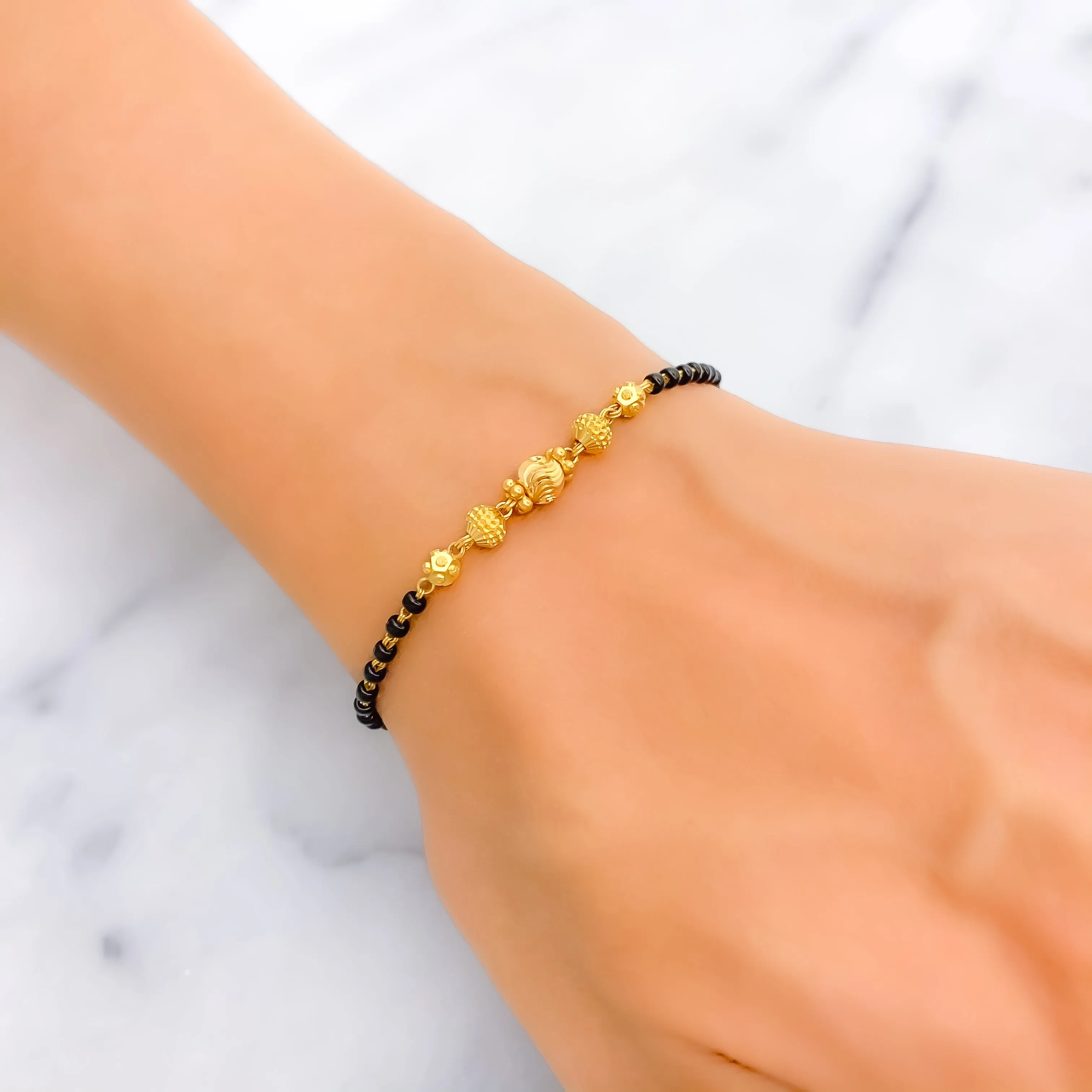 Shimmering Graceful 22k Gold Black Bead Bracelet